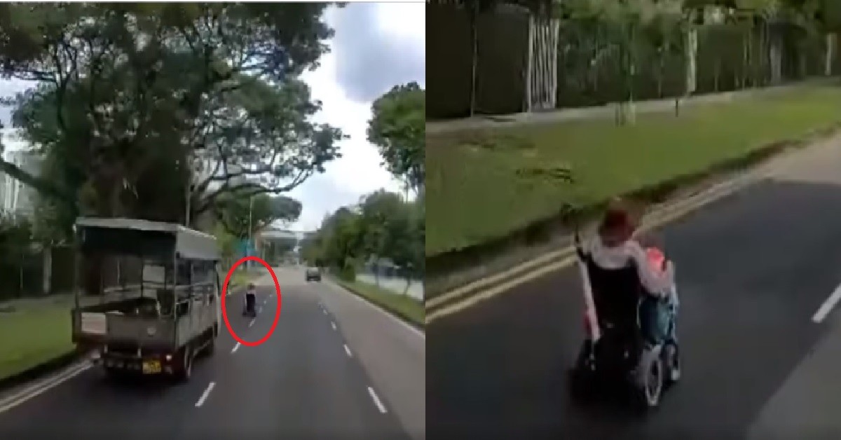 WHEELCHAIR AH MA ON THE ROAD HOGGING ENTIRE LANE, BLOCK LORRY BEHIND