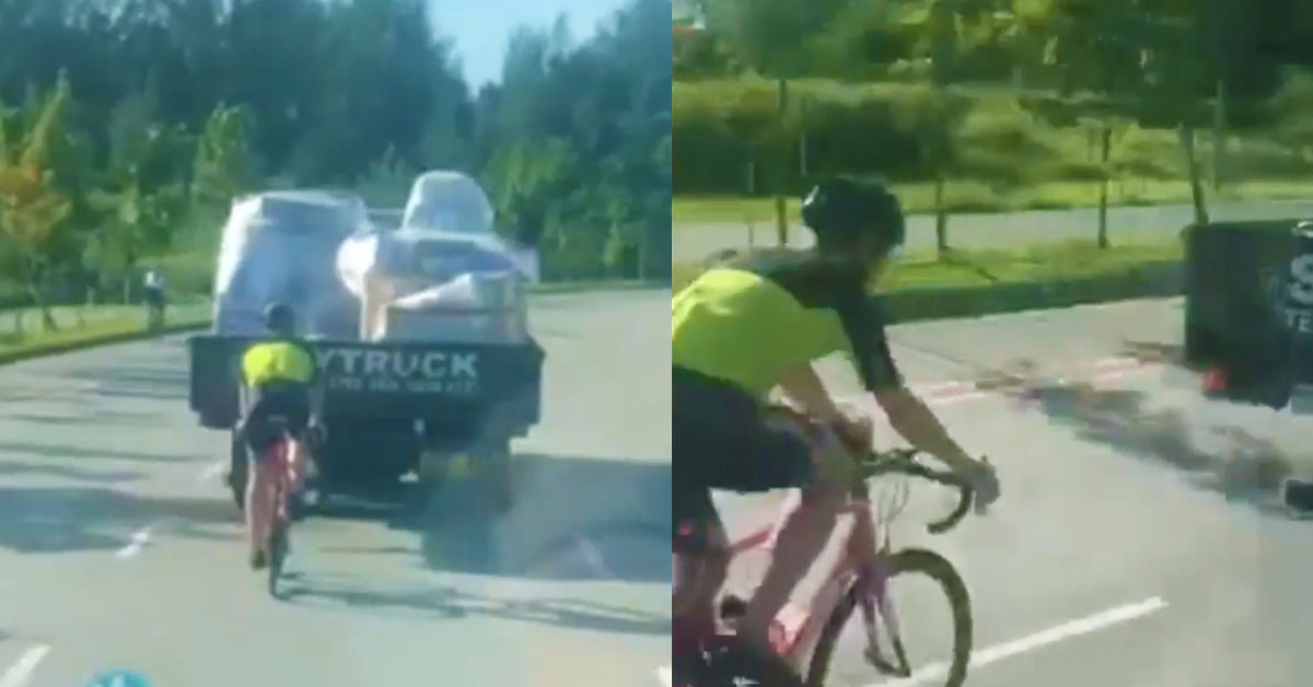 CYCLIST TAILGATES LORRY IN THE MIDDLE OF THE ROAD, THINKS HIS ABOVE THE LAW