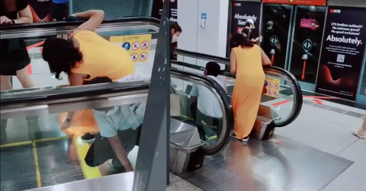 WOMAN’S DRESS TOO LONG STUCK IN ESCALATOR @ DHOBY GAUT MRT