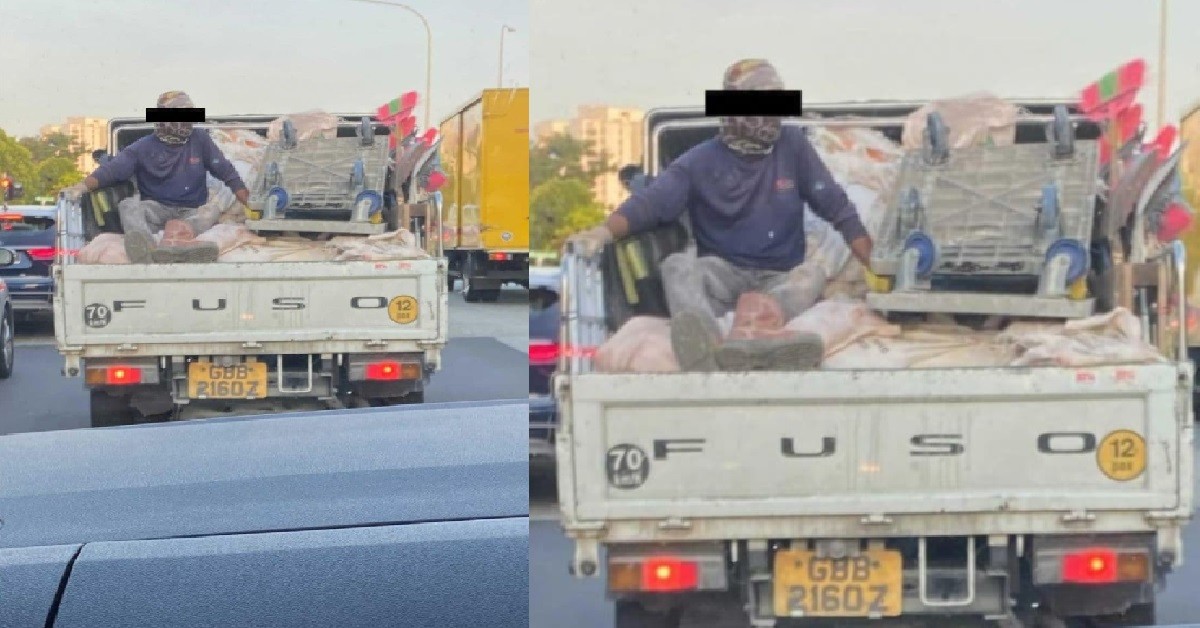 WORKER SEEN SITTING DANGEROUSLY ATOP CARGO @ BACK OF LORRY