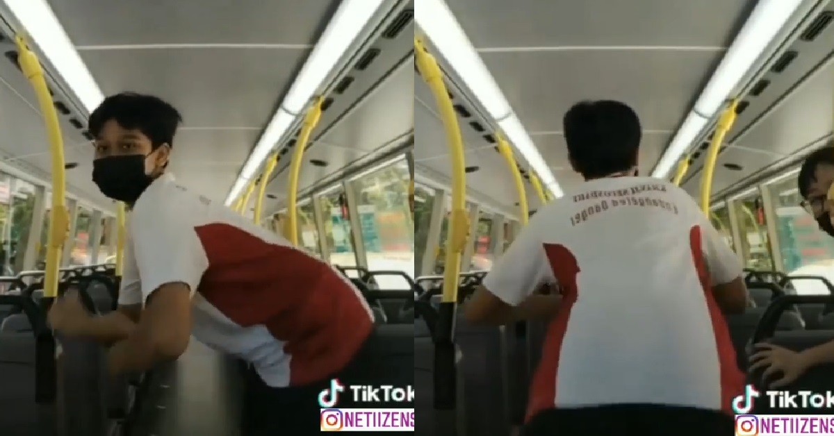 BOY HIDING ON TOP OF DOUBLE DECKER BUS, TO SHAKE HIS BUNS FOR CAMERA