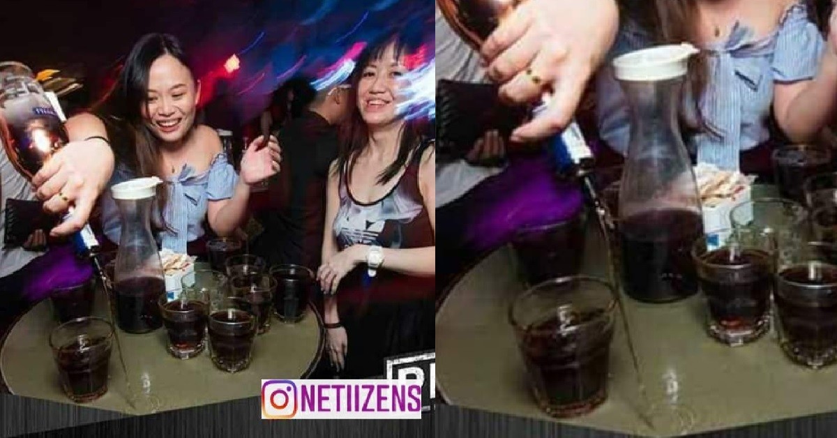 WOMAN BUY MARTELL TO DISINFECT THE TABLE INSIDE CLUB