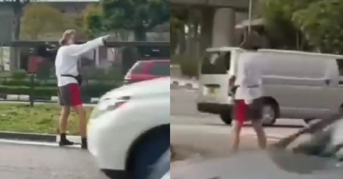 UNCLE CATWALKING IN MIDDLE OF BUSY ROAD, THEN STOP AND POSE