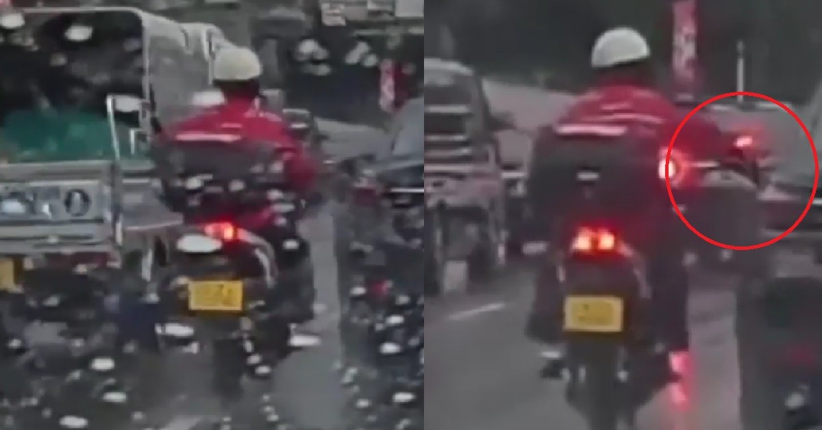 CRAZY MOTORCYCLIST RIDING ON ROAD, SUDDENLY WHACK CAR BESIDE HIM