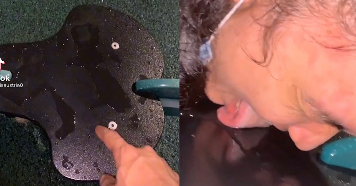 MAN GIVES WET PLAYGROUND SEAT A GOOD SLURPY LICK DRY