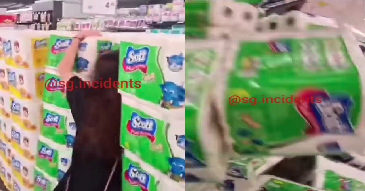XMM KENA PUSHED ONTO STACKS OF TOILET PAPER, WHOLE THING TUMBLE