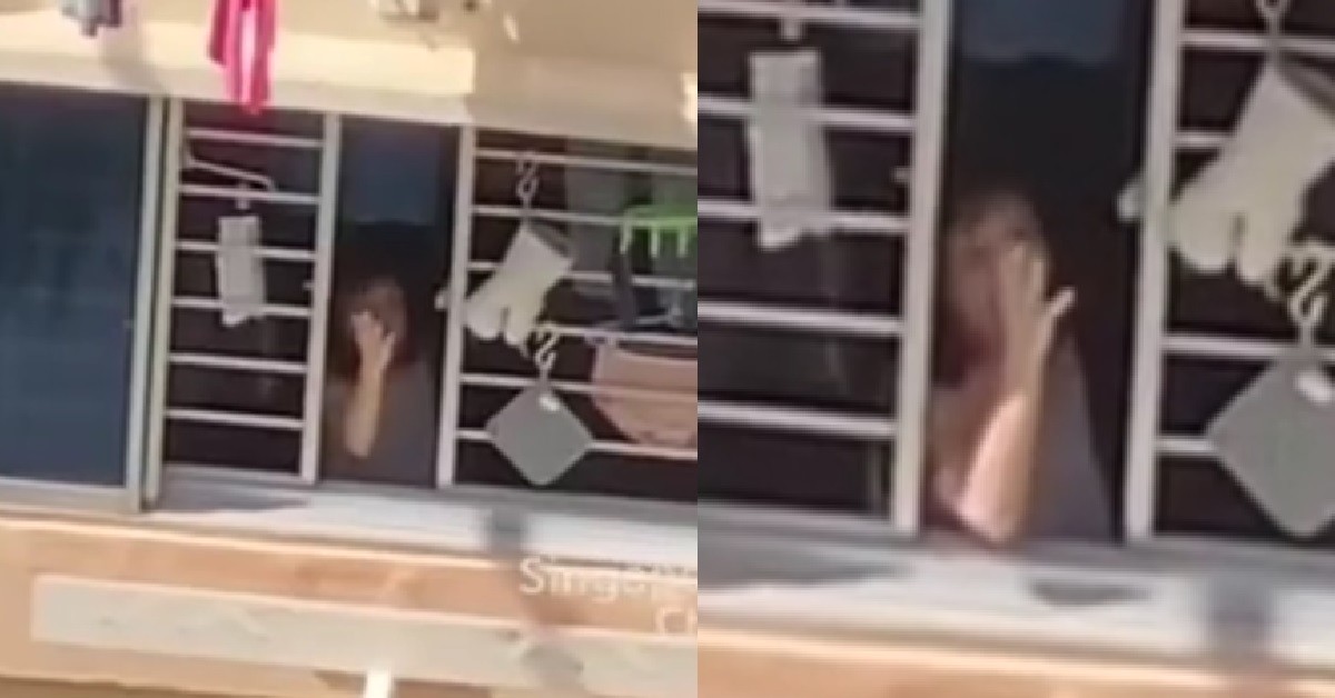 AUNTIE SEEN OPENING HER HOUSE WINDOW TO SCOLD THE AIR
