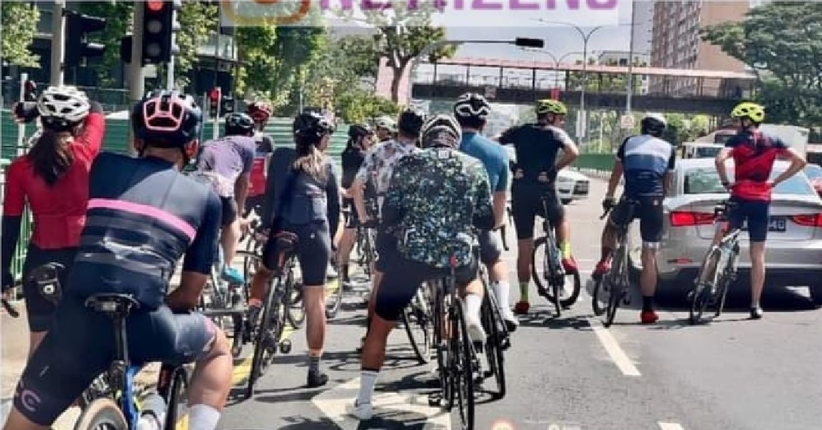 CYCLISTS GATHERED IN GROUP OF 13 TO RIDE ON THE ROAD