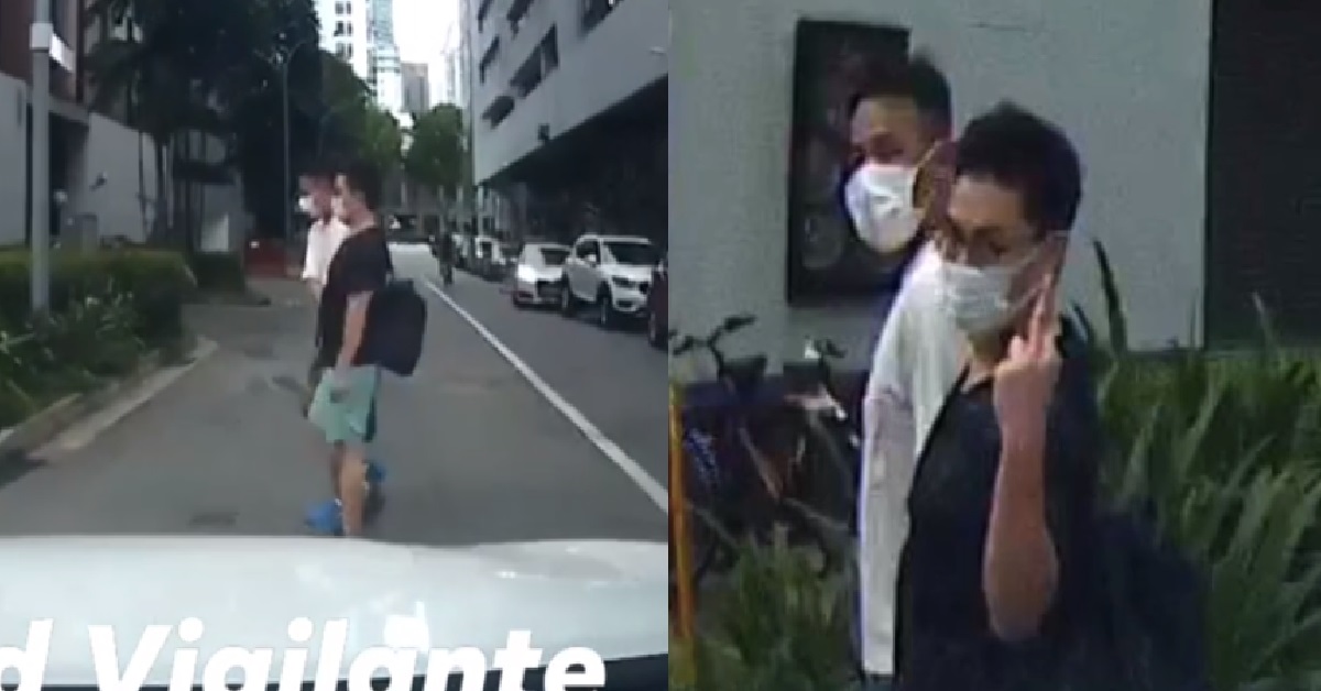 ANGSTY MAN POINTS MIDDLE FINGER AT DRIVER WHILE CROSSING ROAD