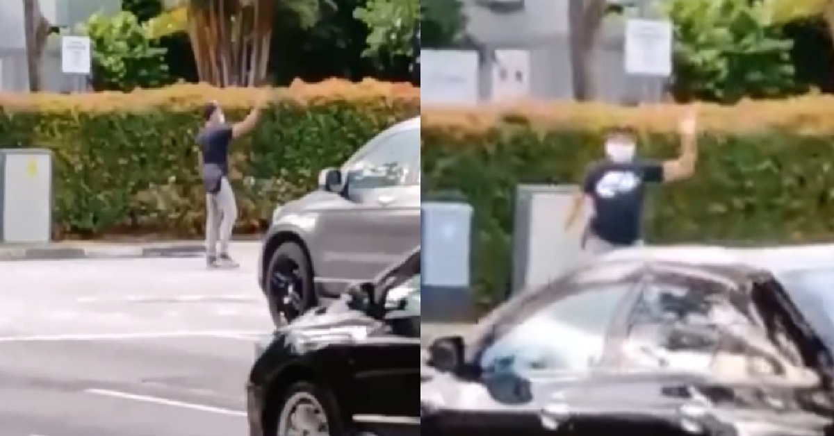 TRAFFIC LIGHTS OUT OF ORDER, KIND MAN STAND IN MIDDLE OF ROAD TO CONTROL TRAFFIC