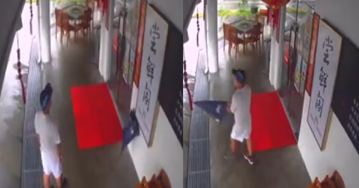 MAN LOITERING SUSPICIOUSLY OUTSIDE RESTAURANT, THEN STEALS UMBRELLA