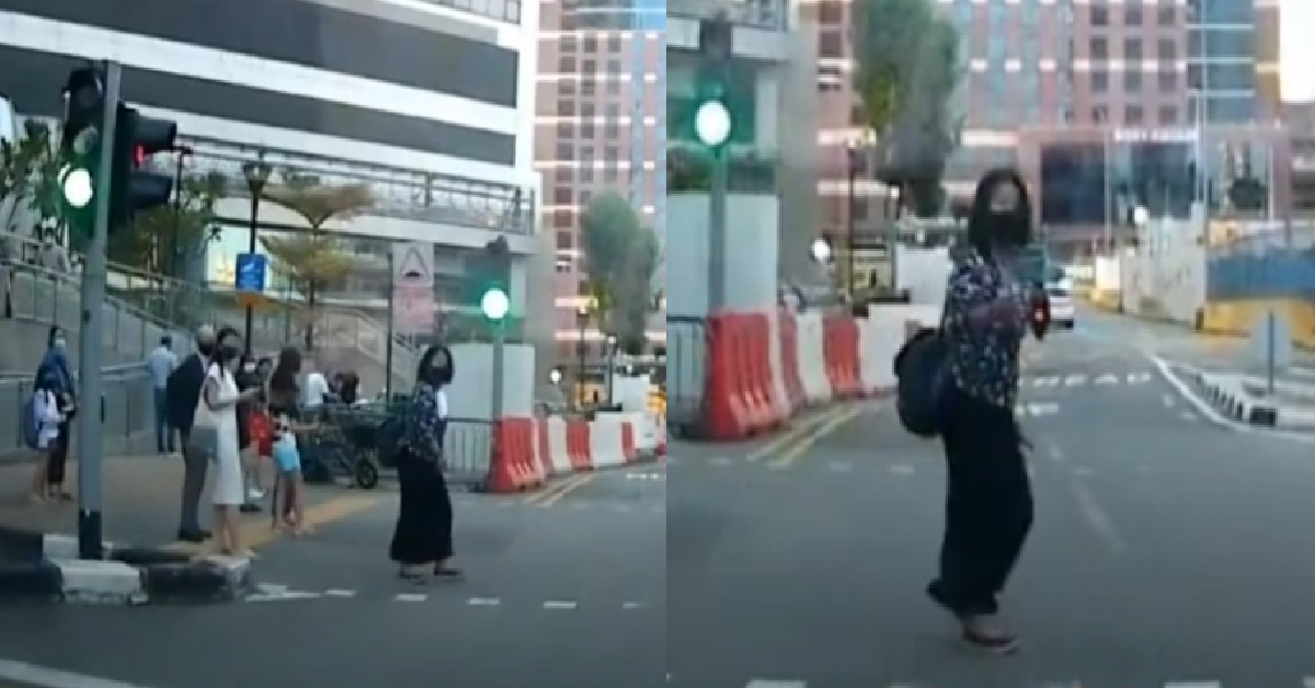 WOMAN KENA HONKED BUT STILL CONTINUES JAYWALKING, STARE AT DRIVER