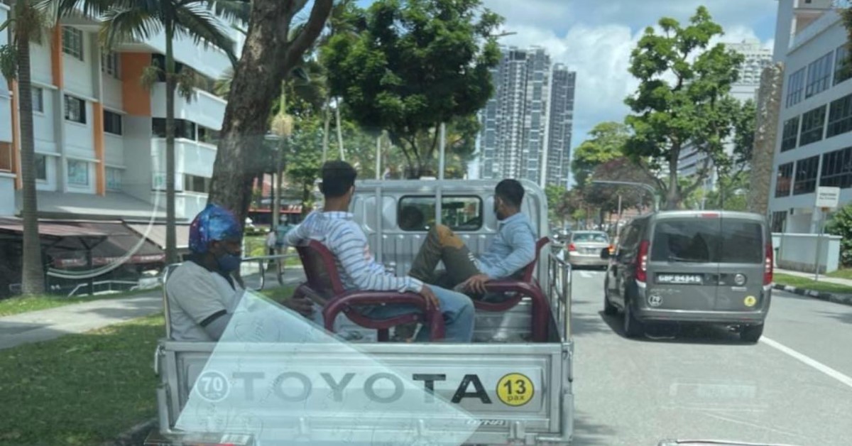 PASSENGERS CAUGHT SITTING DANGEROUSLY ON REAR OF THE LORRY
