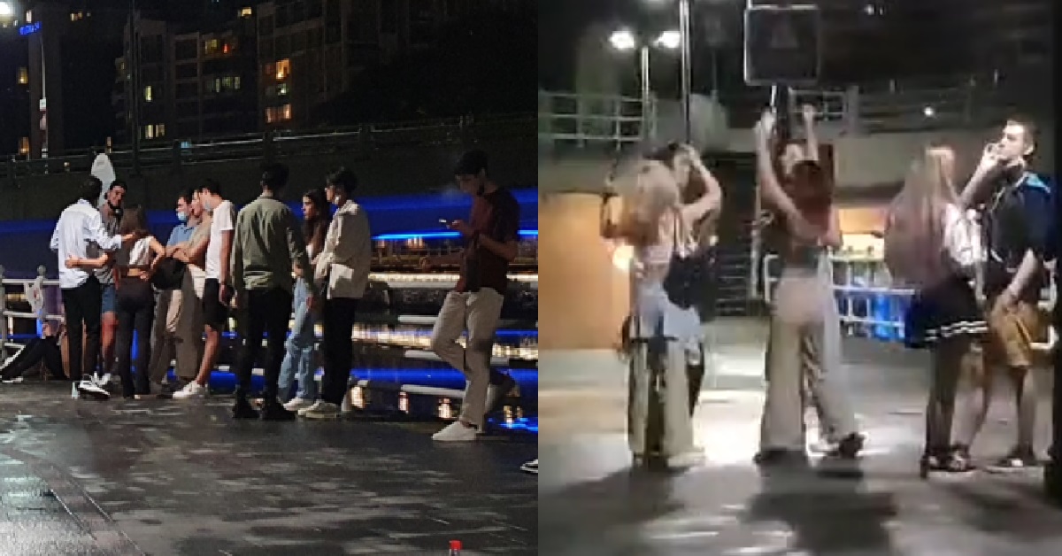 ANG MOHS HAVING DANCE PARTY IN LARGE GROUP BESIDE S’PORE RIVER