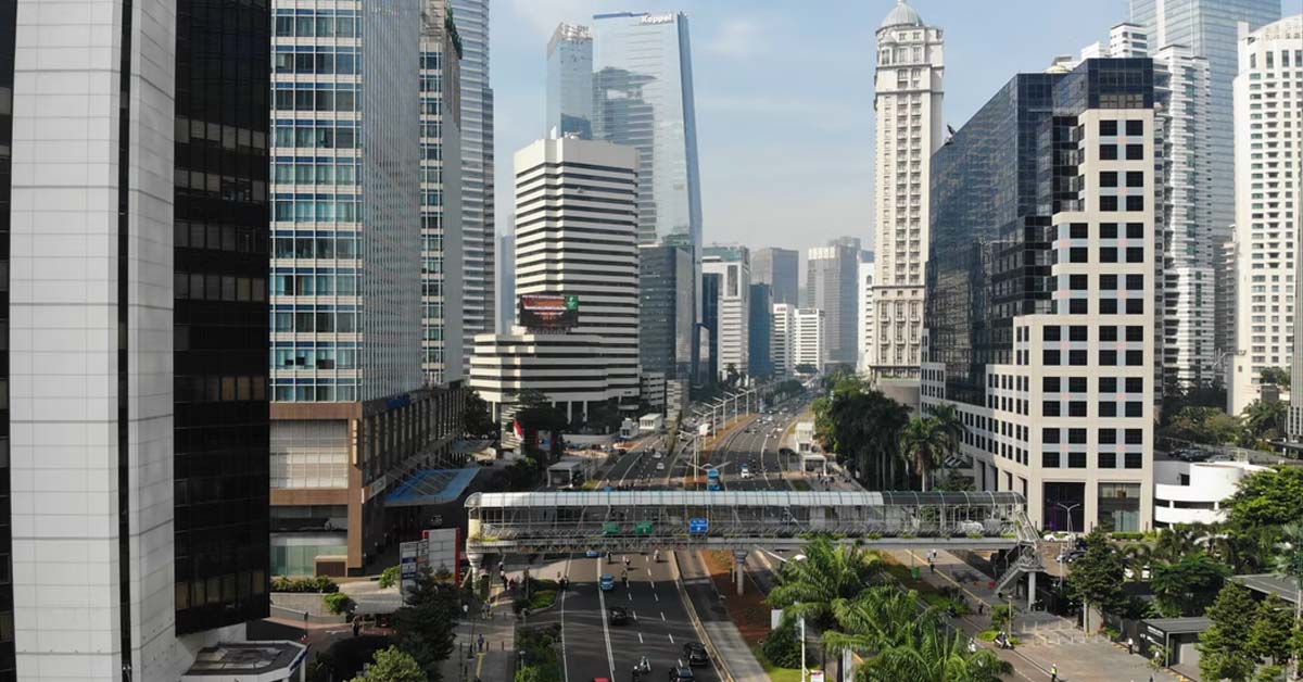 INDONESIA TIGHTENS COVID-19 CURBS AS INFECTIONS SURGE
