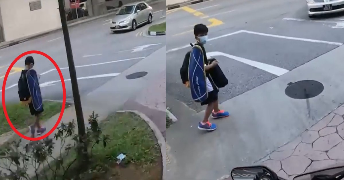SCHOOL BOY ENGROSSED WITH PHONE WHILE CROSSING ROAD, NEAR MISS WITH MOTORBIKE