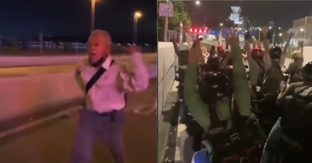 MAN SHOUTING “M’SIA BOLEH” WHILE RUNNING EXCITEDLY ACROSS CAUSEWAY