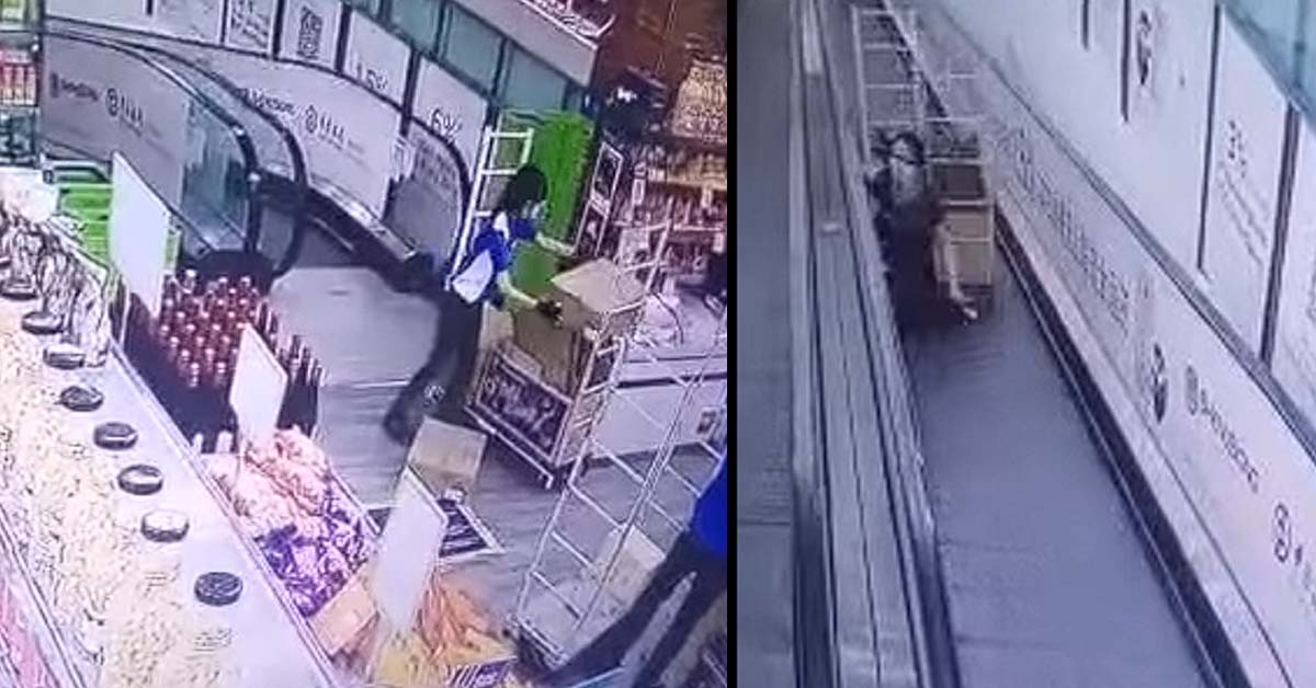 TROLLEY ROLLS DOWN SHENG SION TRAVELATOR AND HIT 2 PEOPLE