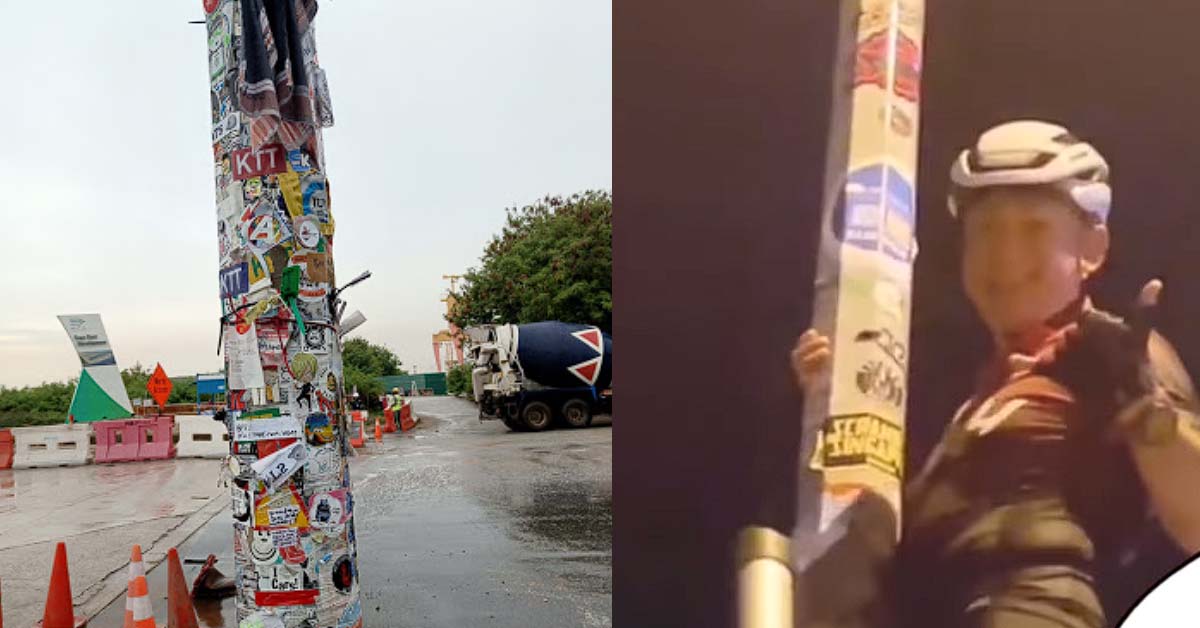 CYCLIST PREPARES LADDER TO PASTE STICKER AT TUAS LAMPOST