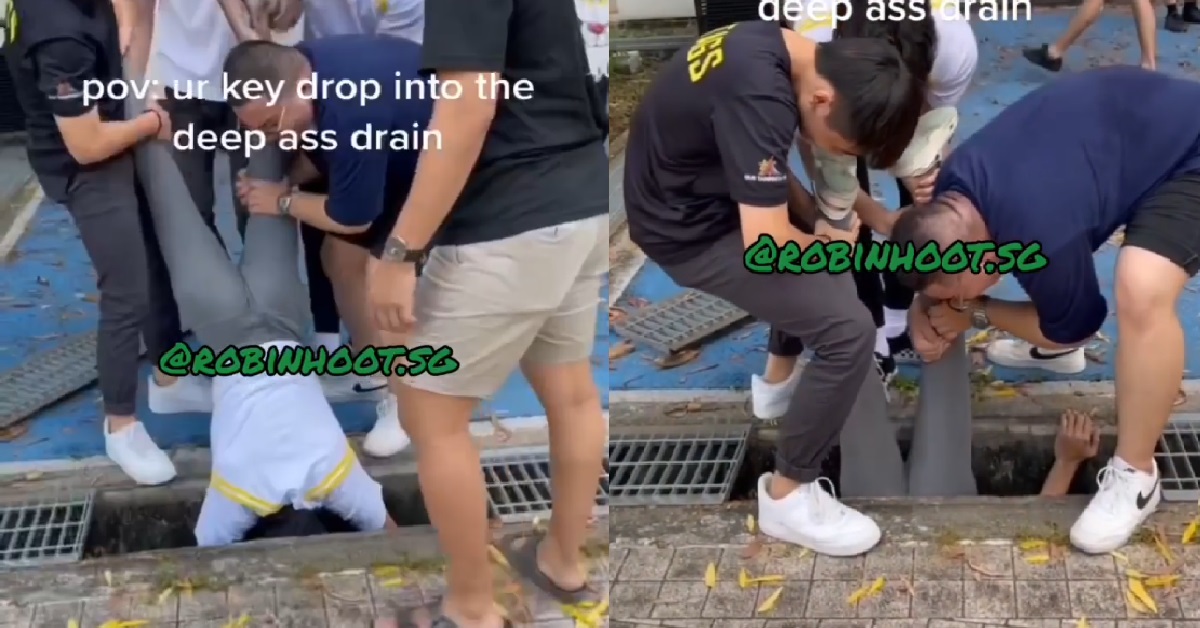 GUY DROPS KEY INTO LONGKANG, FRIENDS HOLD HIM UPSIDE DOWN TO RETRIEVE