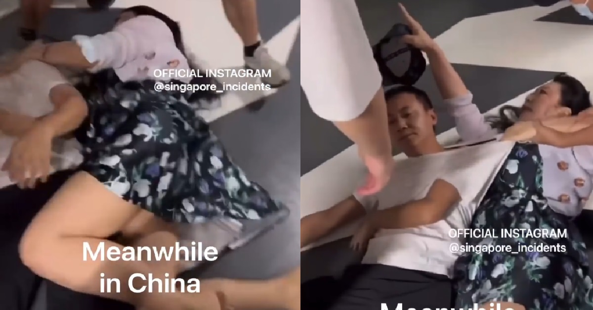 MAN & WOMAN IN CHINA FIGHTING ON THE FLOOR OVER PARKING LOT