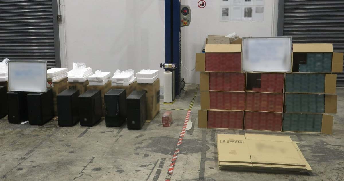 261 CARTONS OF CONTRABAND CIGARETTES SEIZED AT UBI, HIDDEN IN COMPUTER CASES