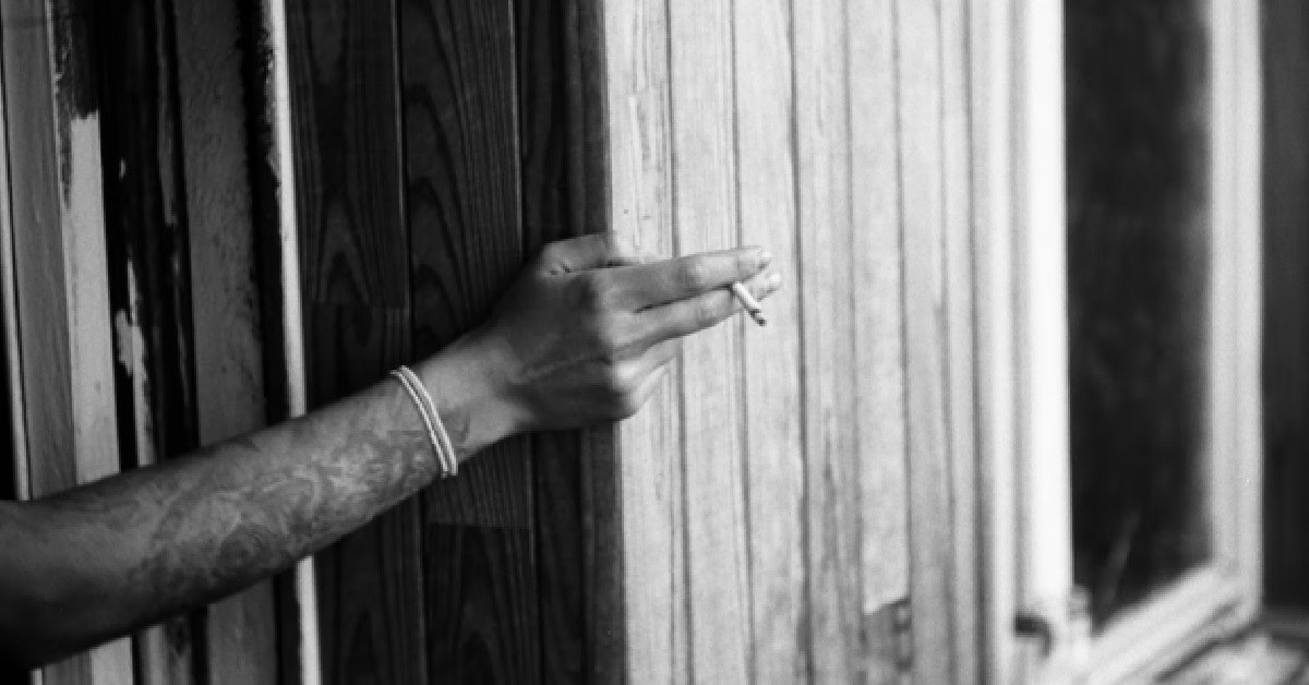 RESIDENT SMOKES AT HIS HDB BALCONY, NEIGHBOURS HAVE TO ALWAY SHUT THEIR WINDOWS