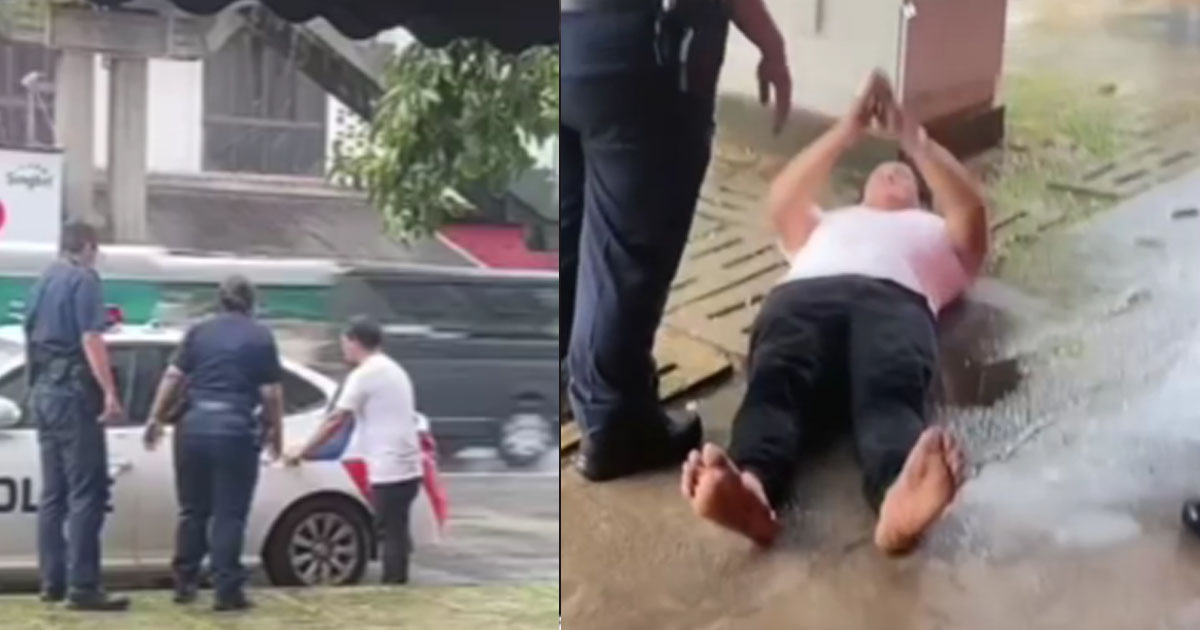 MAN TRIES TO OPEN POLICE CAR THEN LATER LIES ON THE FLOOR PRAYING
