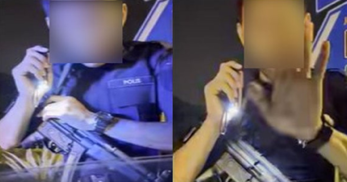 WOMAN STOPPED BY M’SIA POLICE ARMED WITH RIFLE & EXTORTED HER FOR RM200