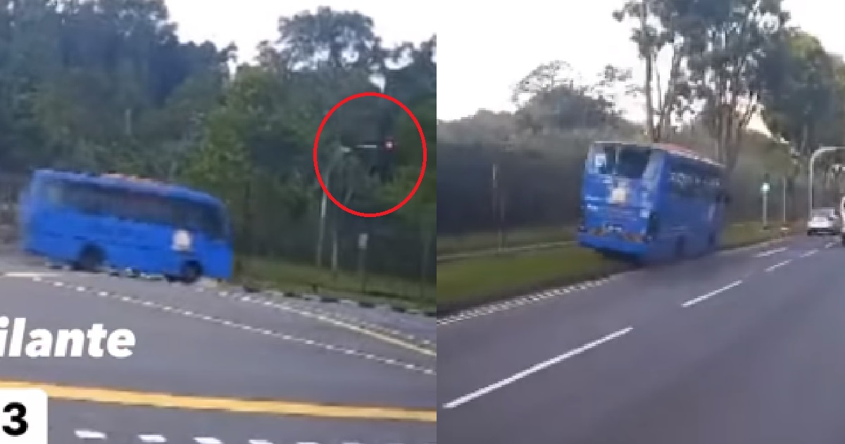 M’SIA BUS BEATS RED LIGHT @ WOODLANDS THEN GETS STUCK AFTER MOUNTING KERB