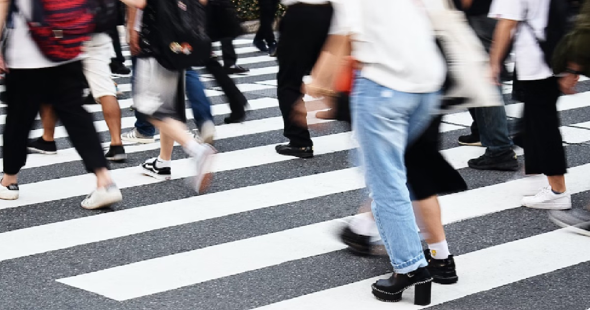 GUY SWINGING HIS HAND WHILE CROSSING ROAD, ACCIDENTALLY “HOLD HANDS” WITH WOMAN