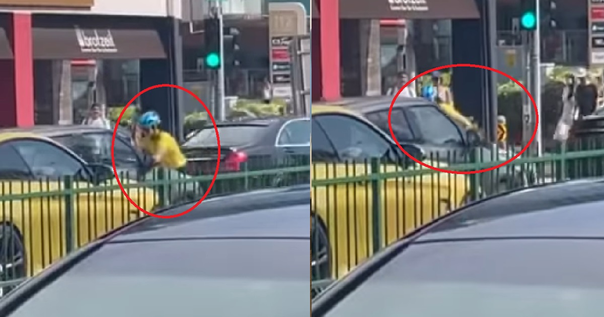 CYCLIST JUMPS ON TOP OF CAR & HOLDS ON TO IT AS THE DRIVER DROVE OFF @ KATONG