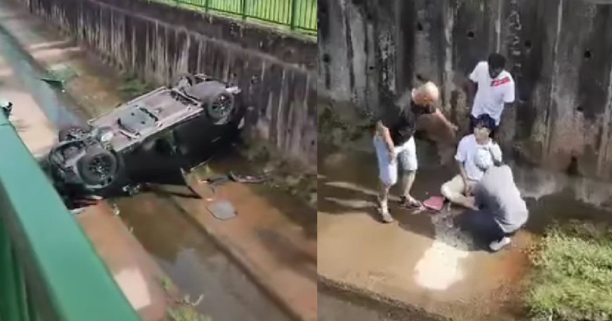 CAR SKIDS & OVERTURNED INTO LONGKANG @ BUKIT BATOK, DRIVER TRAPPED INSIDE