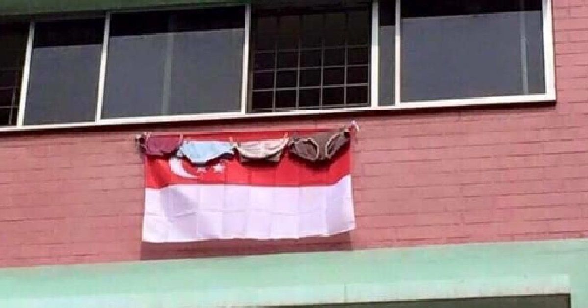 HDB RESIDENT HANGS THEIR UNDERWEAR OVER THE S’PORE FLAG, S’POREANS ANGRY