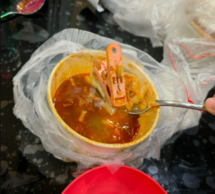 DINER AT JURONG POINT ORDERS TOM YAM FISH SOUP, INSIDE GOT LAUNDRY CLIP